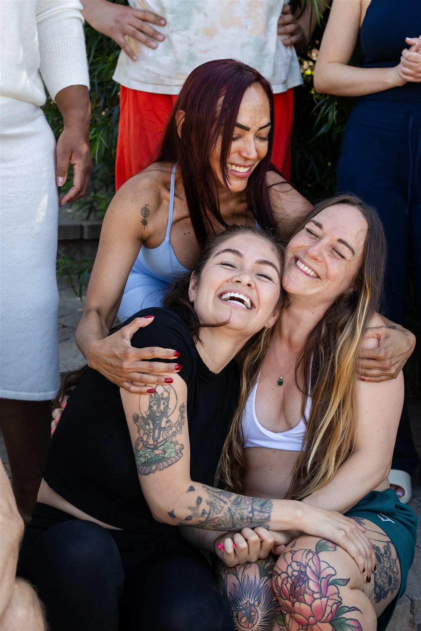 Practitioners laughing together at the end of a LEEF House week